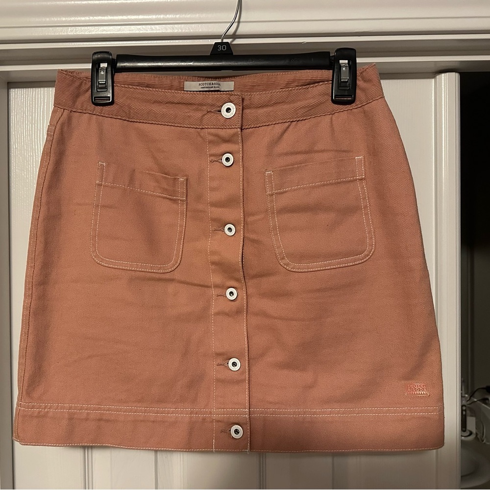 Scotch and soda pink mini with corduroy trim on top.